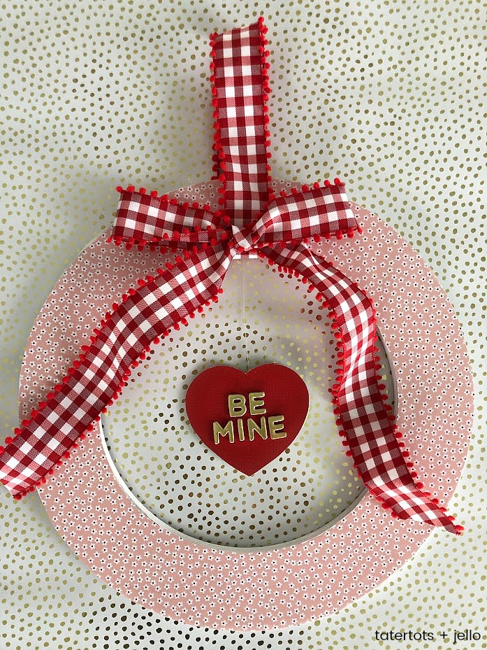 Valentine's Day Floating Conversation Heart Wreath. Turn your favorite paper into a cute wreath for Valentine's Day and add a floating heart with a Valentine's Day saying!