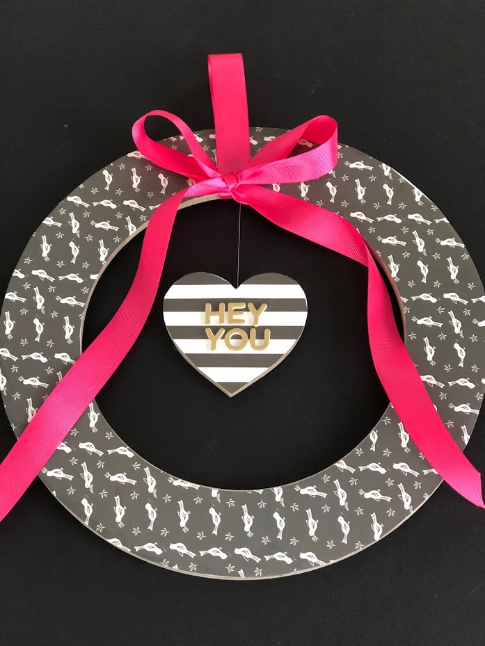 Valentine's Day Floating Conversation Heart Wreath. Turn your favorite paper into a cute wreath for Valentine's Day and add a floating heart with a Valentine's Day saying!