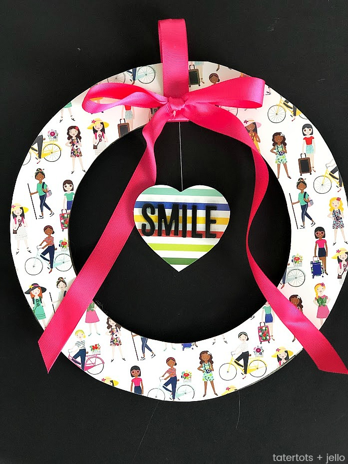 Valentine's Day Floating Conversation Heart Wreath. Turn your favorite paper into a cute wreath for Valentine's Day and add a floating heart with a Valentine's Day saying!