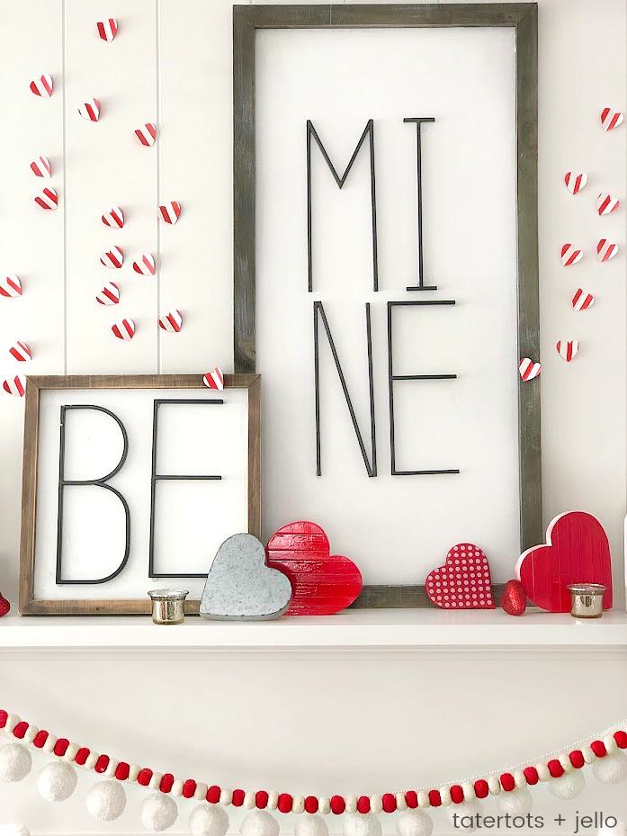 Be Mine Valentine's Day Mantel Ideas! Create a beautiful mantel with these easy and inexpensive DIY ideas -- modern metal letter typography signs, banners and paper hearts!