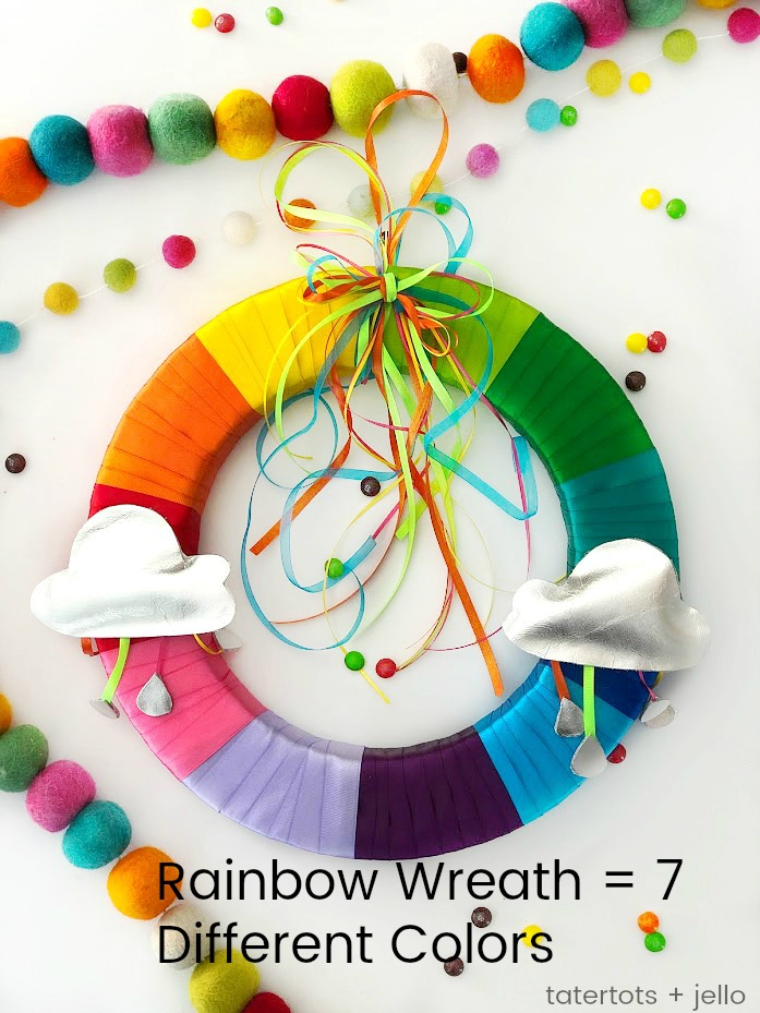 Make a Colorful Rainbow Wreath for Spring with templates! Brighten up your home with a bright ribbon rainbow wreath. It's easy to make with free templates to create the clouds and raindrops and a wreath you will enjoy for years to come! 