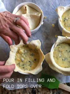 Copycat Panera Spinach and Artichoke Egg Souffles. Fluffy eggs in a delicious spincha artichoke batter baked in layers of light layers of crust will impress weekend guests and the best part is they are SO easy to make!