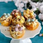 Robin Nests with Whipped Cream Filling - the perfect Spring and Easter treat! Flaky layers of baked puff pastry dough cups cradle creamy, whipped filling topped by toasted coconut and rich chocolate eggs. Bake up a beautiful dessert for Spring and Easter in just minutes! 
