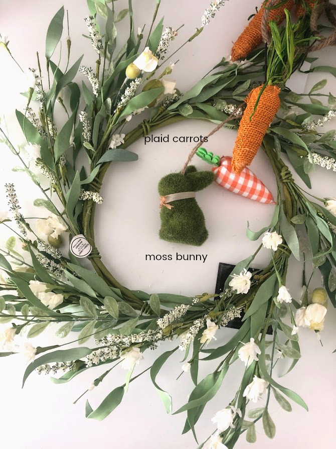 Spring Plaid Carrot Layered Wreath. Layer pretty orange gingham and a pretty floral wreath with a moss bunny and plaid carrots for a wreath that will welcome your guests this Spring!