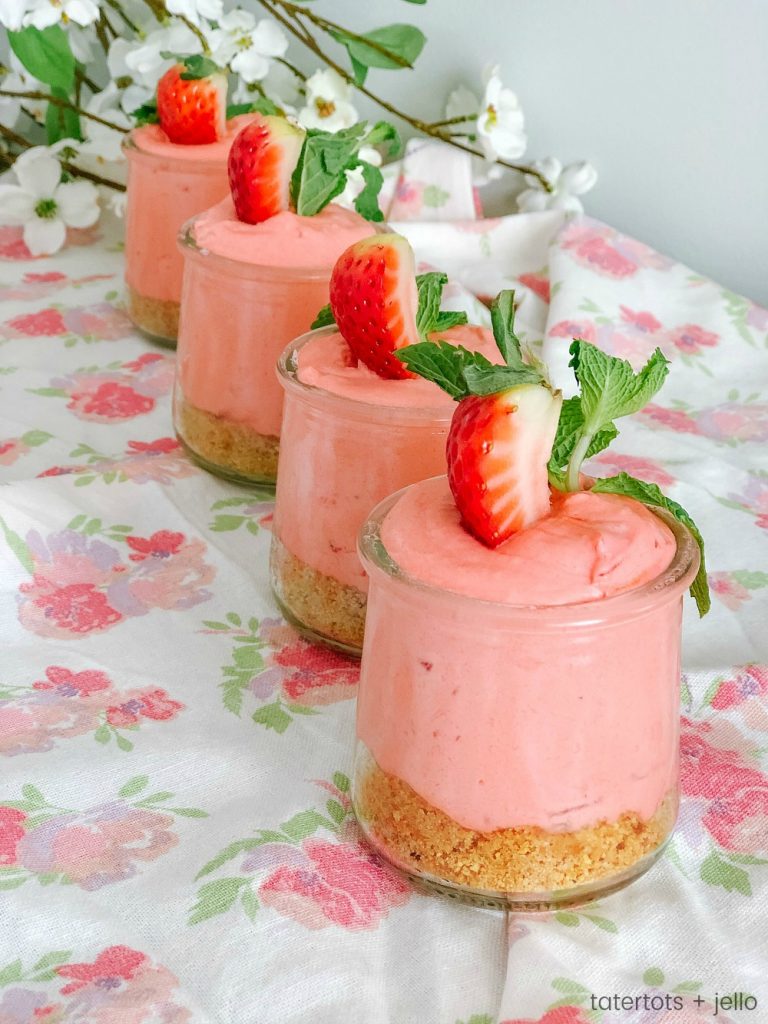 Fluffy Strawberry Cheesecake Mousse! Kick Spring off by making this easy and delicious, light and creamy mousse. It's a great dessert to make ahead of time and wow your dinner guests! 