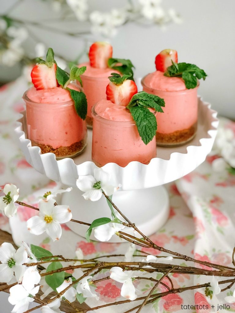 Fluffy Strawberry Cheesecake Mousse! Kick Spring off by making this easy and delicious, light and creamy mousse. It's a great dessert to make ahead of time and wow your dinner guests! 