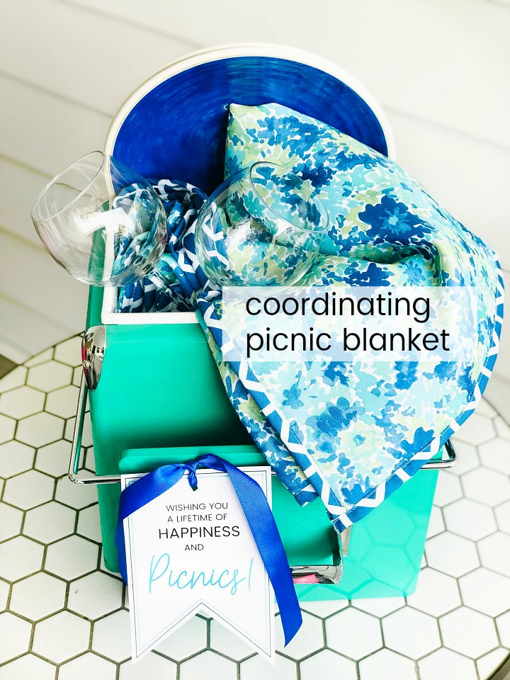 Picnic Basket Wedding Gift Idea and Free Printable Tag. Looking for the perfect wedding or newlywed gift? A picnic basket filled with a handy picnic blanket, plates and glasses and a cute printable tag is something the happy couple will use for years to come! ﻿