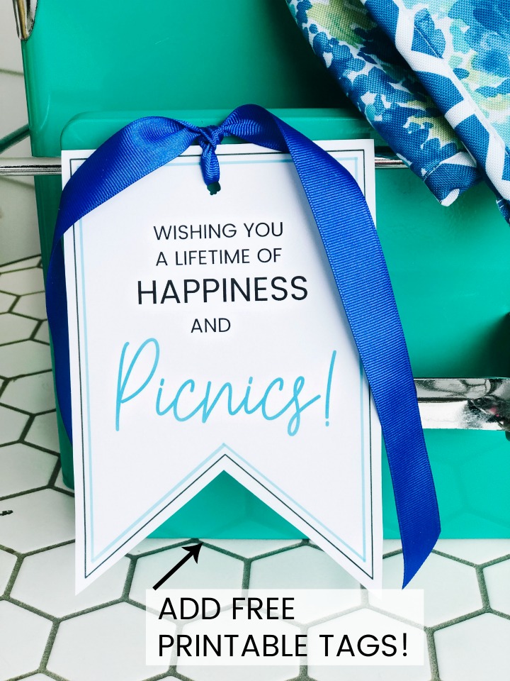 Picnic Basket Wedding Gift Idea and Free Printable Tag. Looking for the perfect wedding or newlywed gift? A picnic basket filled with a handy picnic blanket, plates and glasses and a cute printable tag is something the happy couple will use for years to come! ﻿