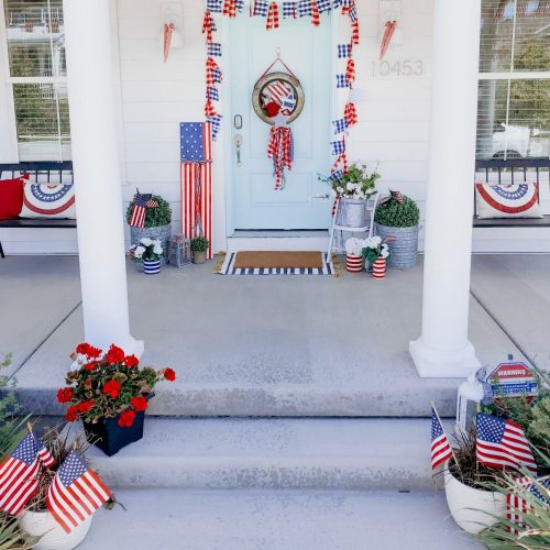 Patriotic Flag Fourth of July Porch. 6 Simple ways to create a bright and colorful porch for the Fourth of July. A handmade giant flag sign, flag wreath, banners and more!