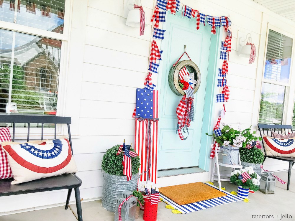 Patriotic Flag Fourth of July Porch. 6 Simple ways to create a bright and colorful porch for the Fourth of July. A handmade giant flag sign, flag wreath, banners and more!