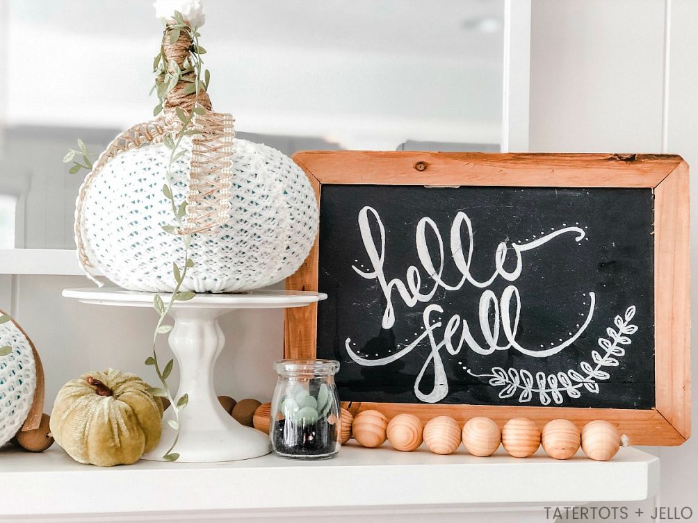 How to make easy fall sweater pumpkins. Use inexpensive dollar store pumpkins and transform them into beautiful decor with thrifted sweaters!