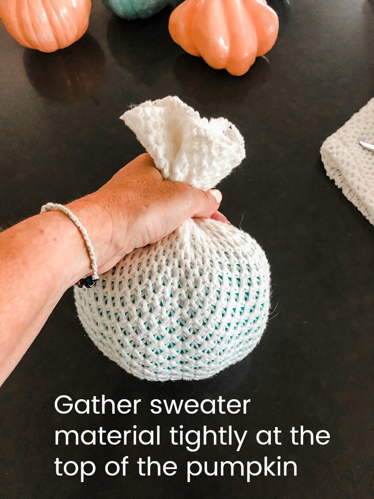 How to make easy fall sweater pumpkins. Use inexpensive dollar store pumpkins and transform them into beautiful decor with thrifted sweaters! 