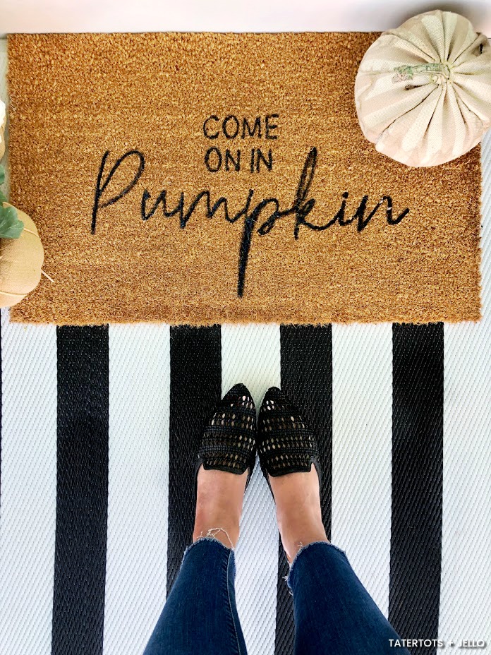 Make an Easy Fall Stenciled Doormat! All you need is a plain doormat and paint to create a welcoming doormat for Fall.