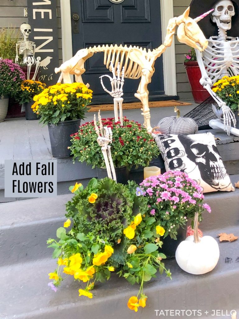 7 Easy Ways to Create a Spooky Skeleton Halloween Porch! Add fresh flowers, lanterns, signs, banners and wreaths to create the perfect spooky Halloween porch! 