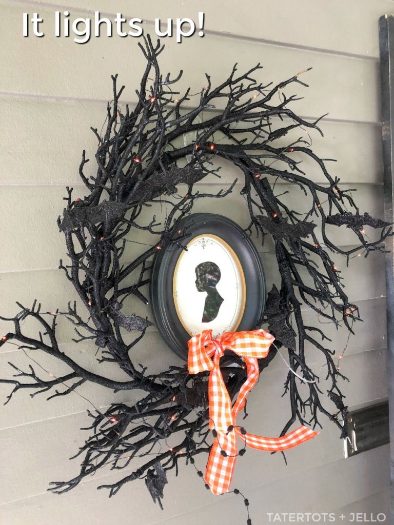 spooky black branch wreath with light up red bat eye lights. 