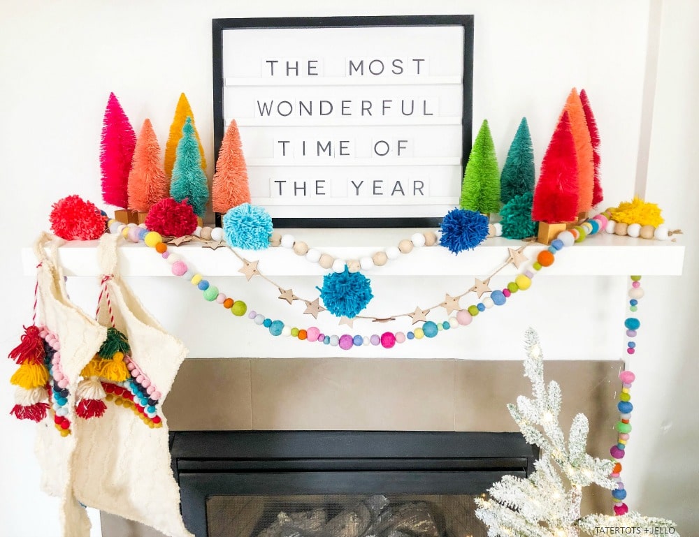 Farmhouse Wood Bead and Pom Pom Garland. Create a beautiful garland for the holidays or all winter long with yarn and beads. 