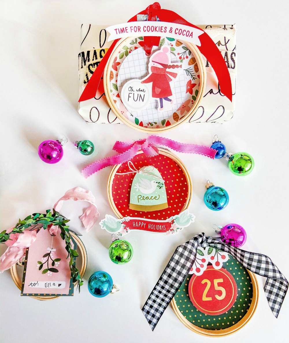 Embroidery Hoop Holiday Gift Toppers. Create adorable holiday gift toppers ornaments with embroidery hoops and paper! They can be used each year as ornaments.