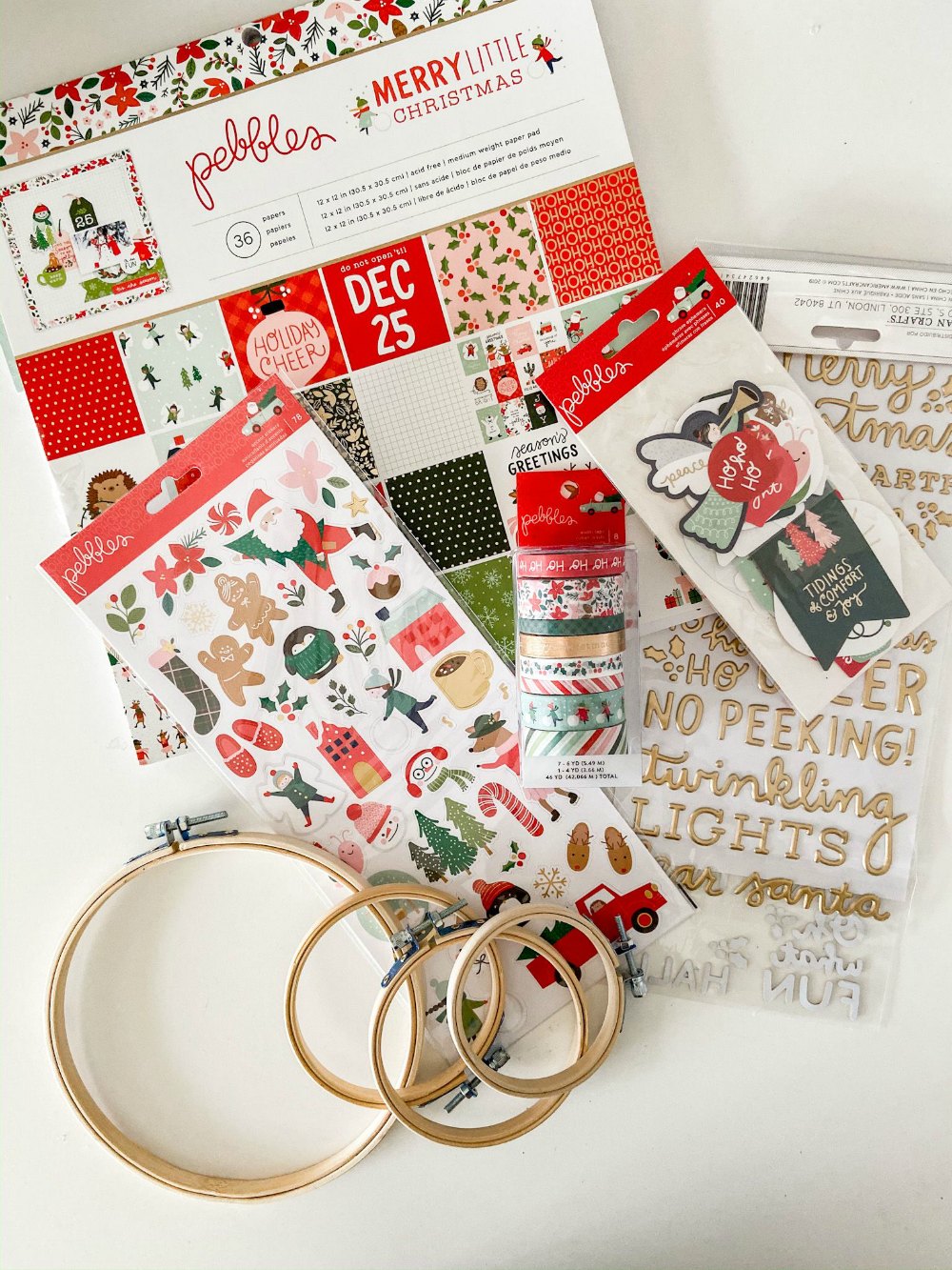 Embroidery Hoop Holiday Gift Toppers. Create adorable holiday gift toppers ornaments with embroidery hoops and paper! They can be used each year as ornaments.