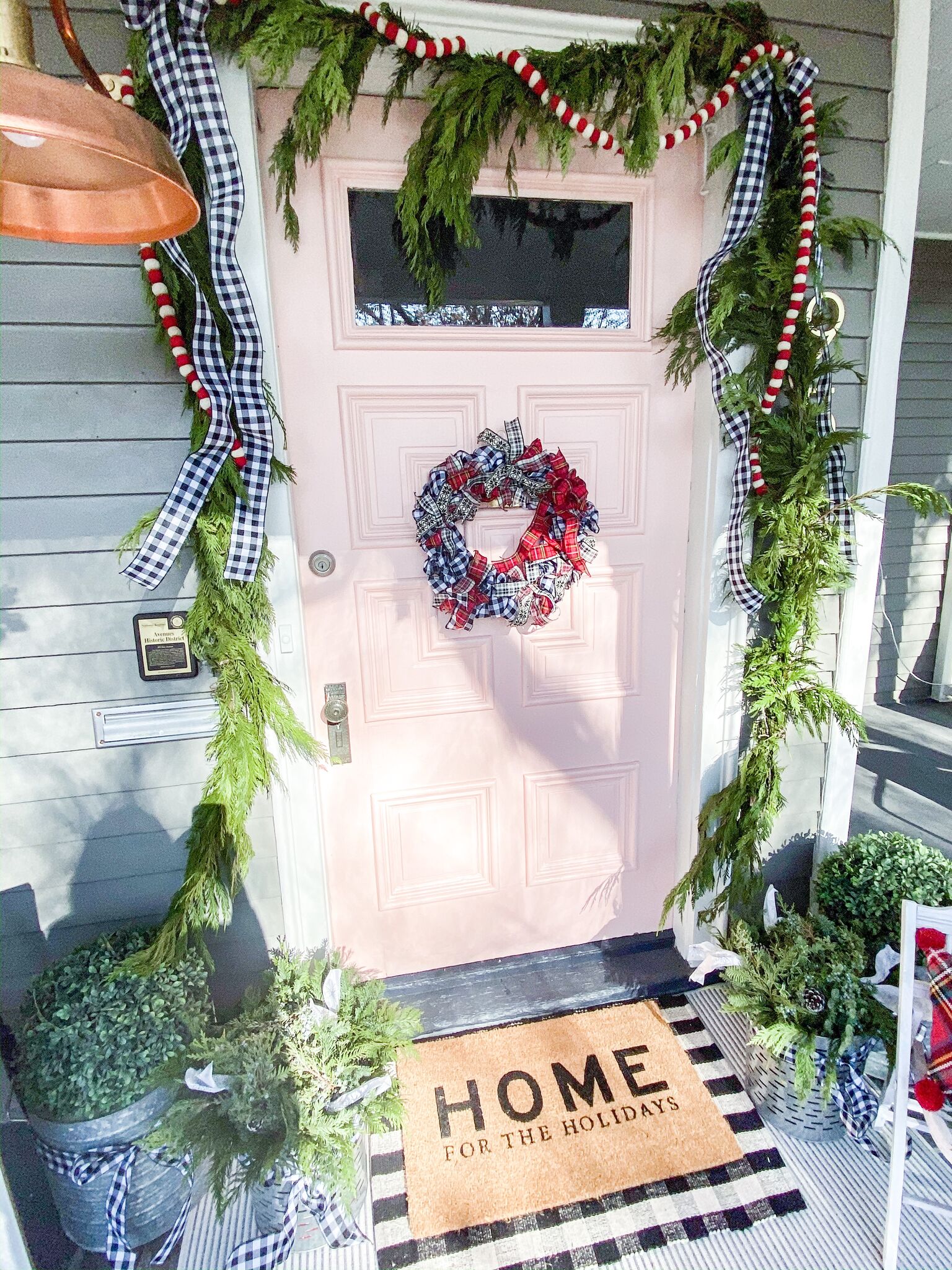 Easy Plaid Ribbon Holiday Wreath Tutorial. Use ribbon to create a festive plaid wreath that is perfect to display all holiday long!