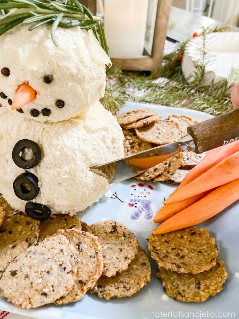 15-Minute Snowman White Cheese Ball Recipe. Mozzarella, cream cheese, Worchesterchire sauce and spices rolled in shaved Parmesan cheese. Divide the cheese ball into two parts and make it into a delightful snowman that will be the hit of any holiday or Winter party!