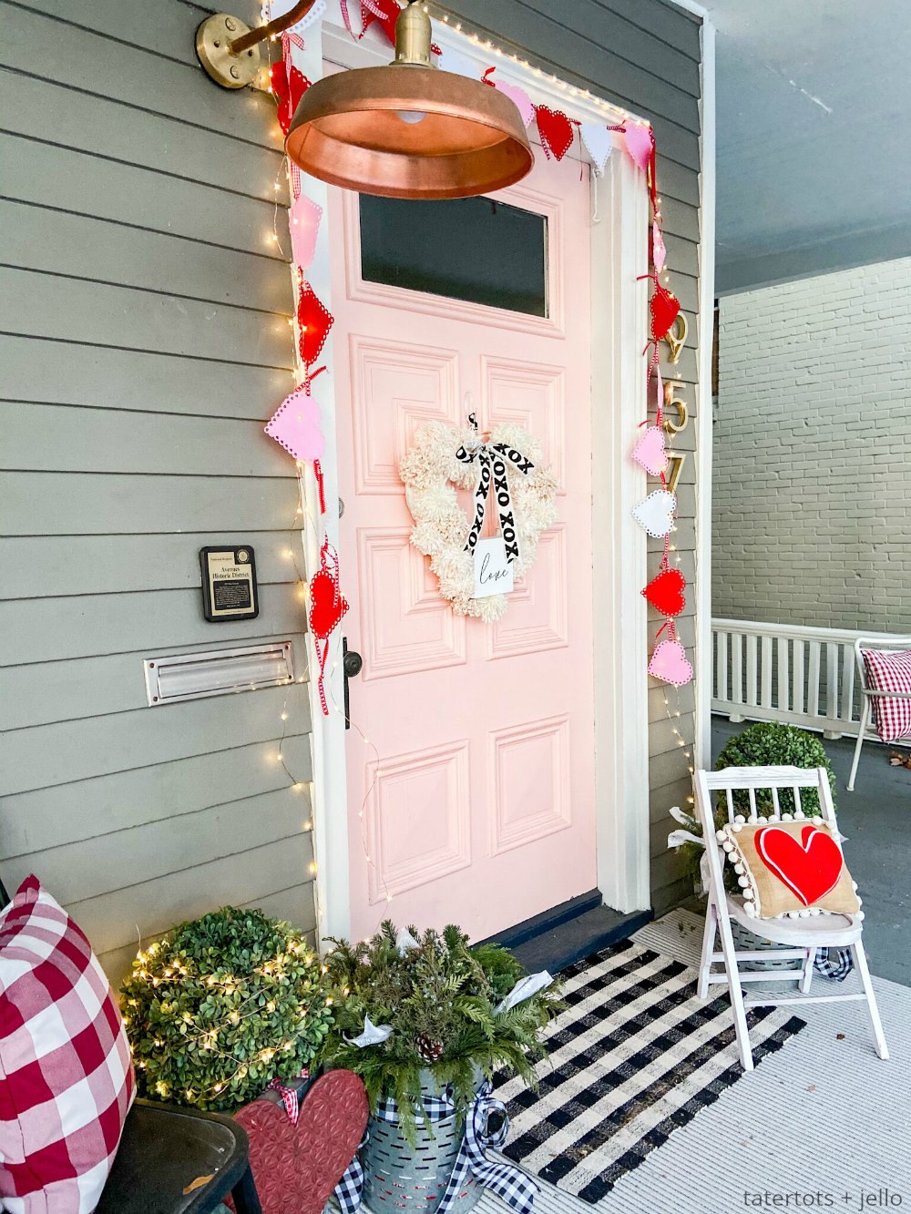 How to Make a Valentine Heart Pom Pom Yarn Wreath. Brighten up your door this winter with a textured pom pom wreath for valentine's Day!
