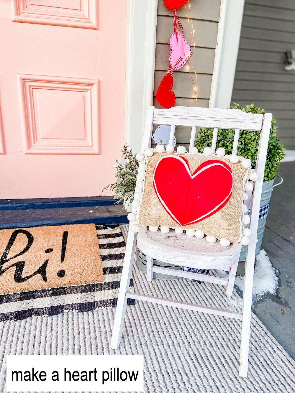 Pink and Red Valentine's Porch. Make a DIY garland, sign, banner, pillow and wreath to create a bright and colorful porch for Valentine's Day! 