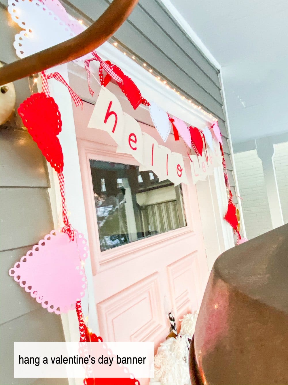 Pink and Red Valentine's Porch. Make a DIY garland, sign, banner, pillow and wreath to create a bright and colorful porch for Valentine's Day! 