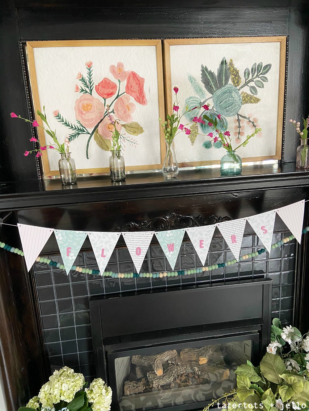 Simple Spring Flower Mantel. Colorful flower art, sweet vases of flowers and a handmade banner are easy to put together to bring some Spring sunshine to your mantel.