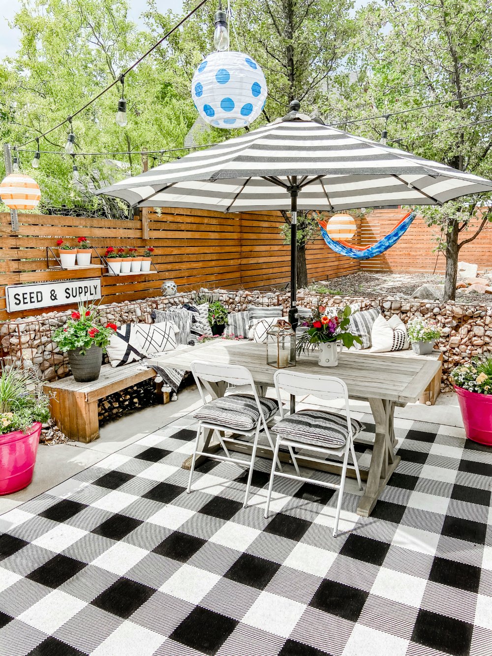 DIY Hanging Patio Garden. Make the most of your patio space by hanging shelves and planting flowers or herbs in painted pots! 