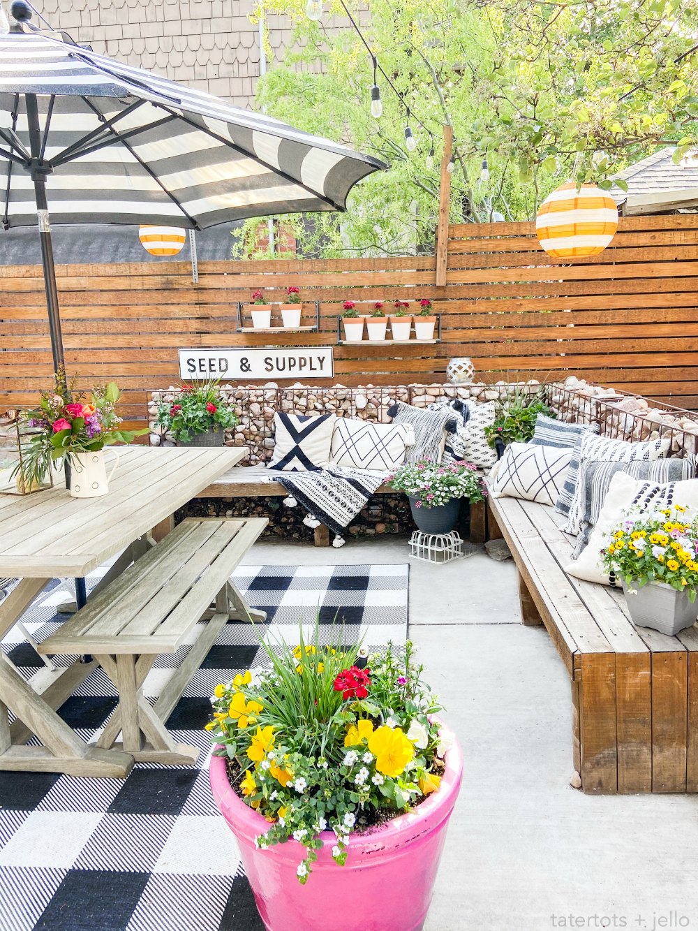 DIY Hanging Patio Garden. Make the most of your patio space by hanging shelves and planting flowers or herbs in painted pots! 