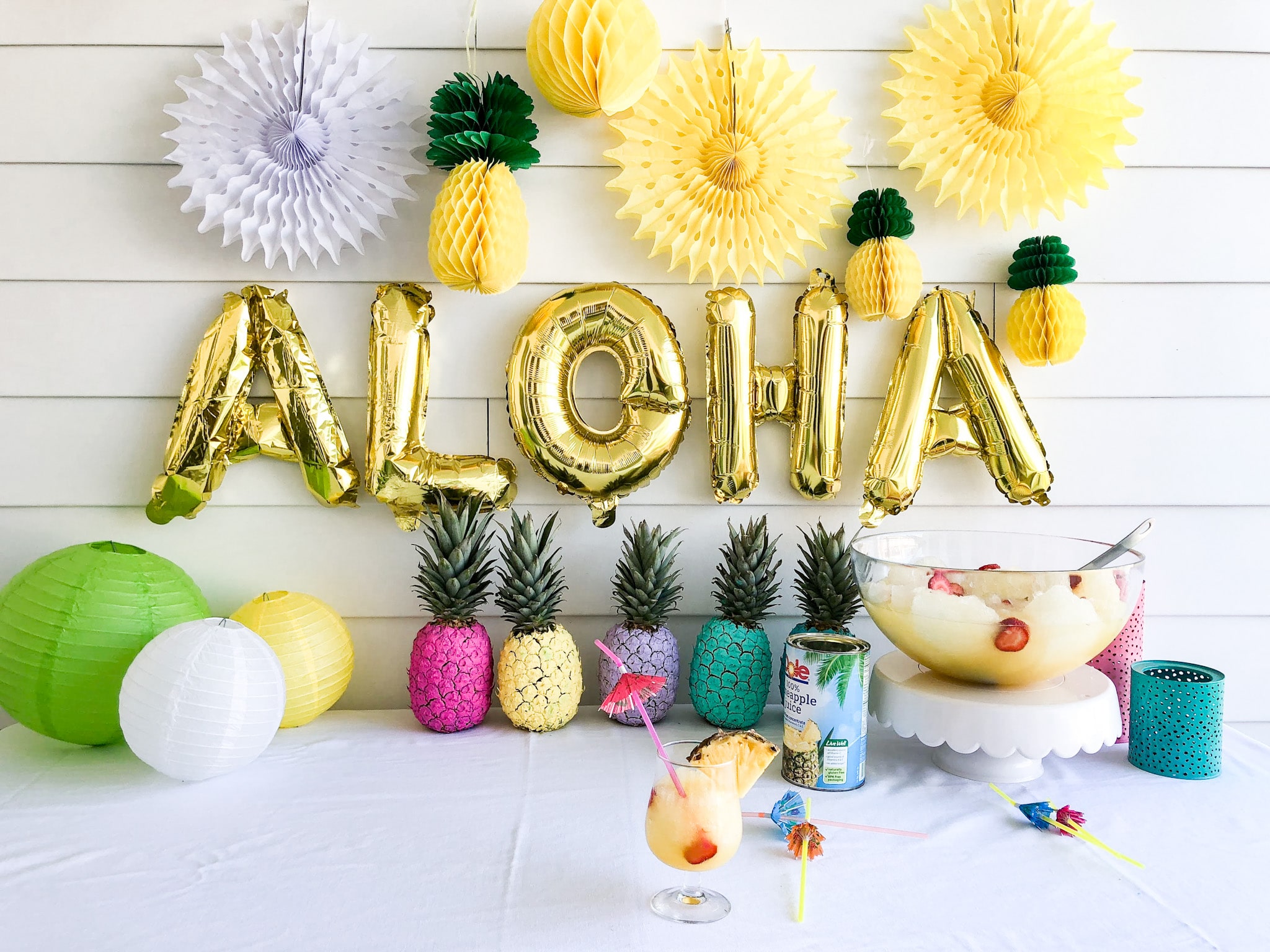 Pineapple Lime Luau Slushy Punch is a party must! Refreshing pineapple and tangy lime combine favors in this fizzy, fruity, slushy punch that makes enough for a crowd!