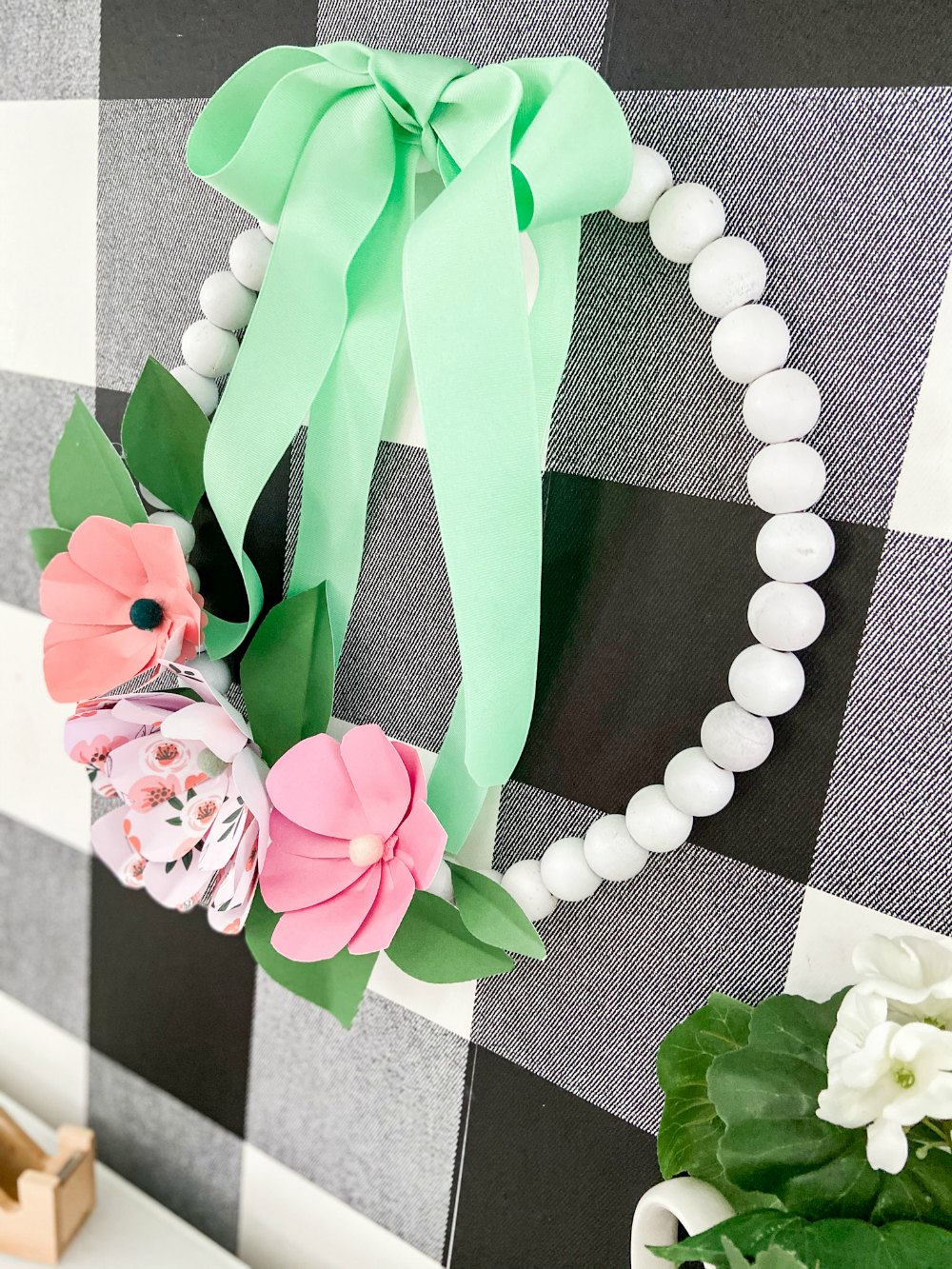 Wood Bead Wreath with Paper Flowers. Make this trendy wood bead wreath and create easy paper flowers with free petal and leaves template!