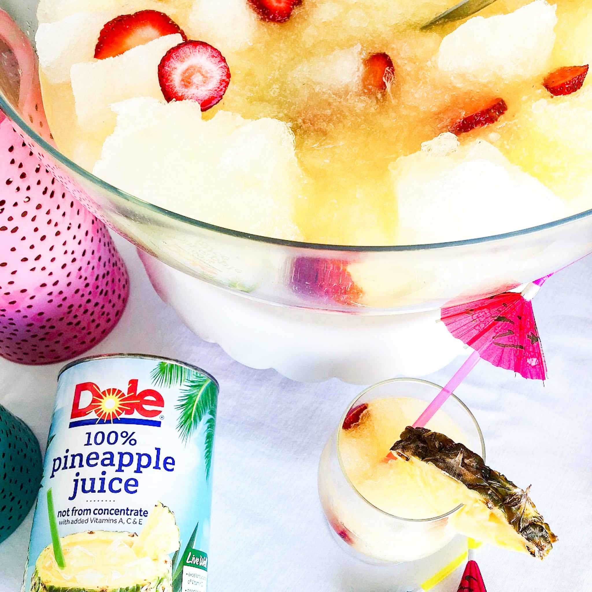 Pineapple Lime Luau Slushy Punch is a party must! Refreshing pineapple and tangy lime combine favors in this fizzy, fruity, slushy punch that makes enough for a crowd!