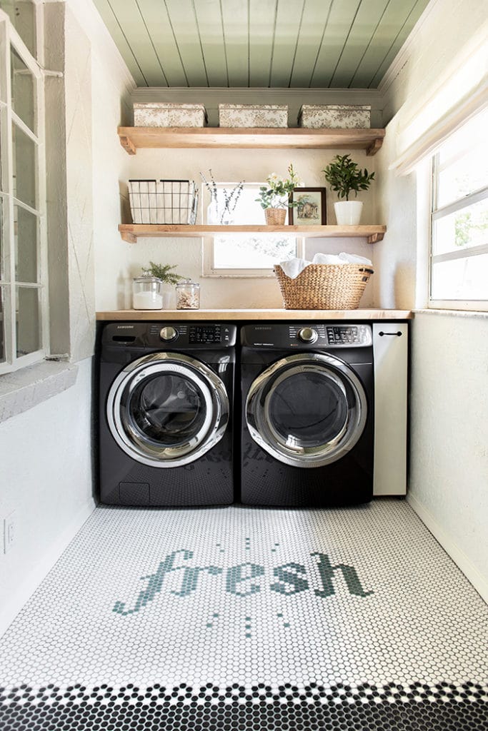 fresh tile spelled out on laundry room floor.