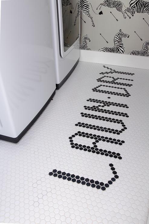 Laundry spelled out in hex tiles in a laundry room.