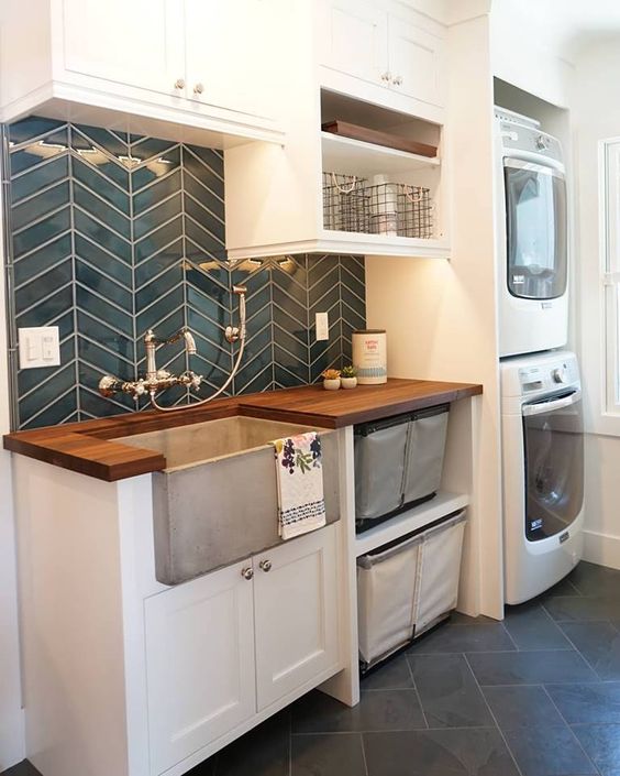 Cement farmhouse sink in a farmhouse laundry room.