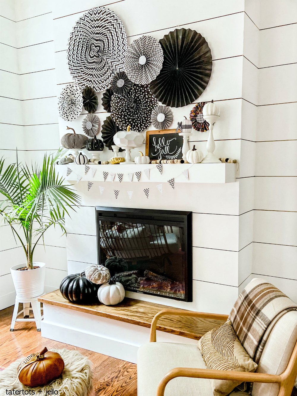 Easy Black and White Fall Mantel! Create a striking black and white mantel with pumpkins, DIY paper medallions and paper banner! 