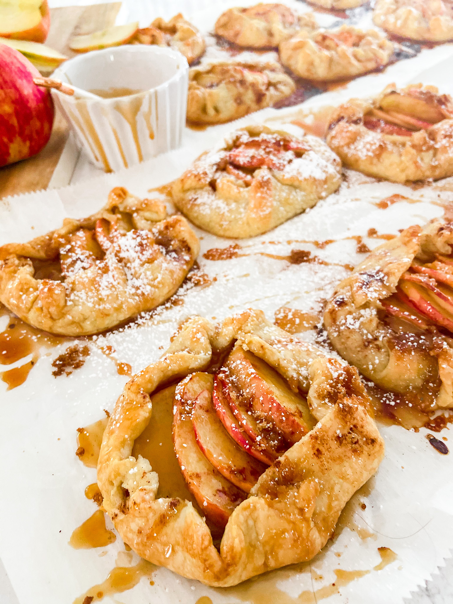 Rustic Mini Apple Galettes. It's apple season! Celebrate by making these easy rustic apple hand pies. They are perfect for fall picnics and family desserts! 