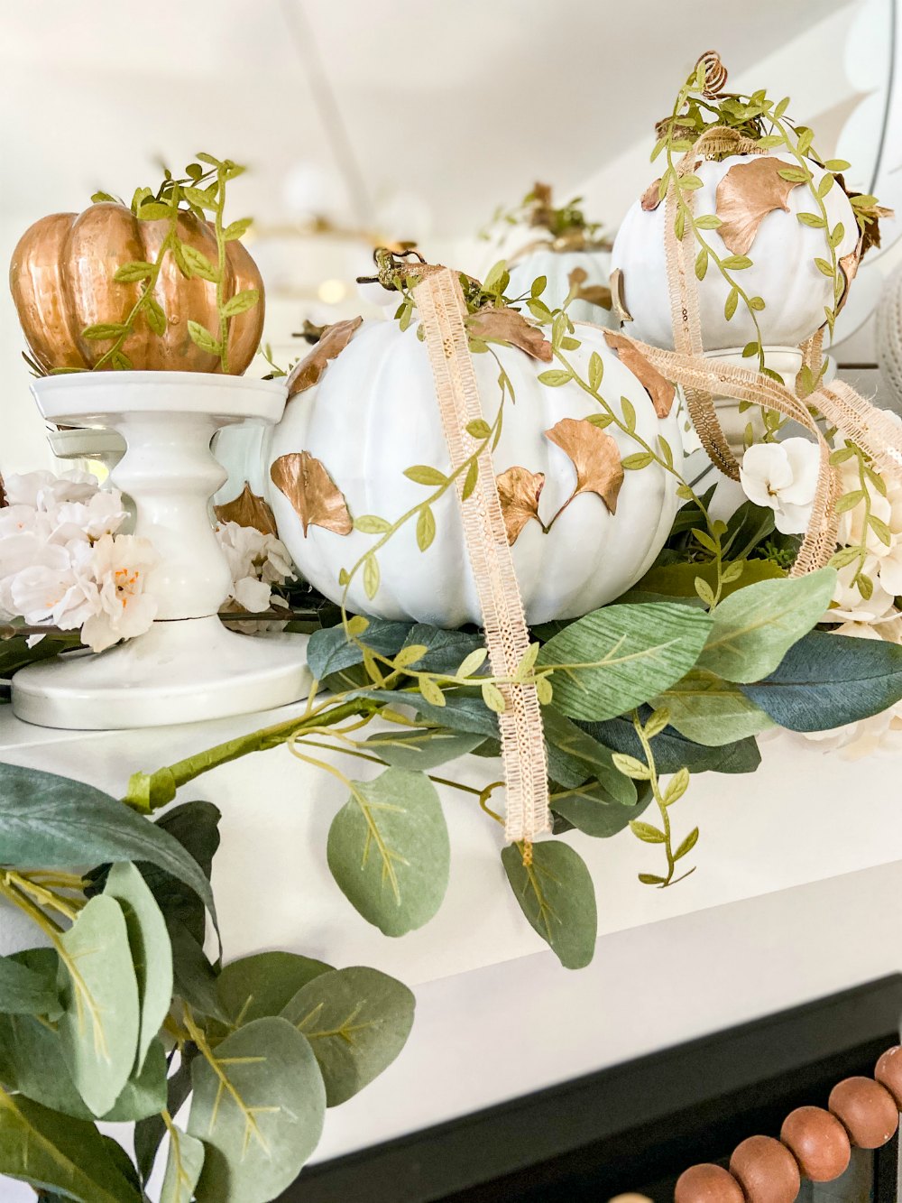 DIY Gilded Leaf Pumpkins. Celebrate fall with a leaf-inspired pumpkin for a fresh take on Autumn.