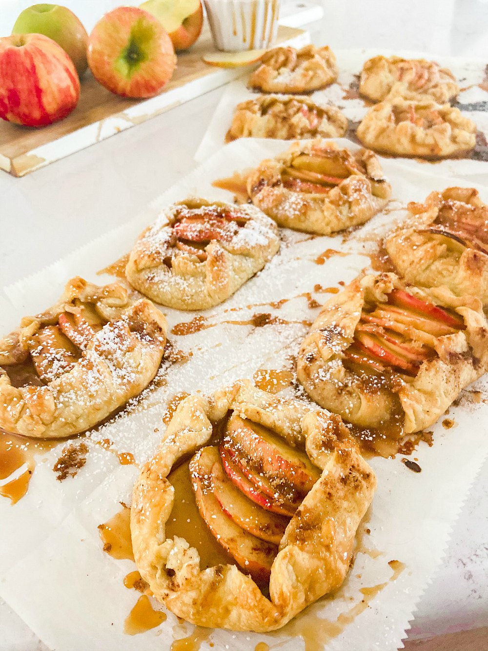 Rustic Mini Apple Galettes. It's apple season! Celebrate by making these easy rustic apple hand pies. They are perfect for fall picnics and family desserts! 