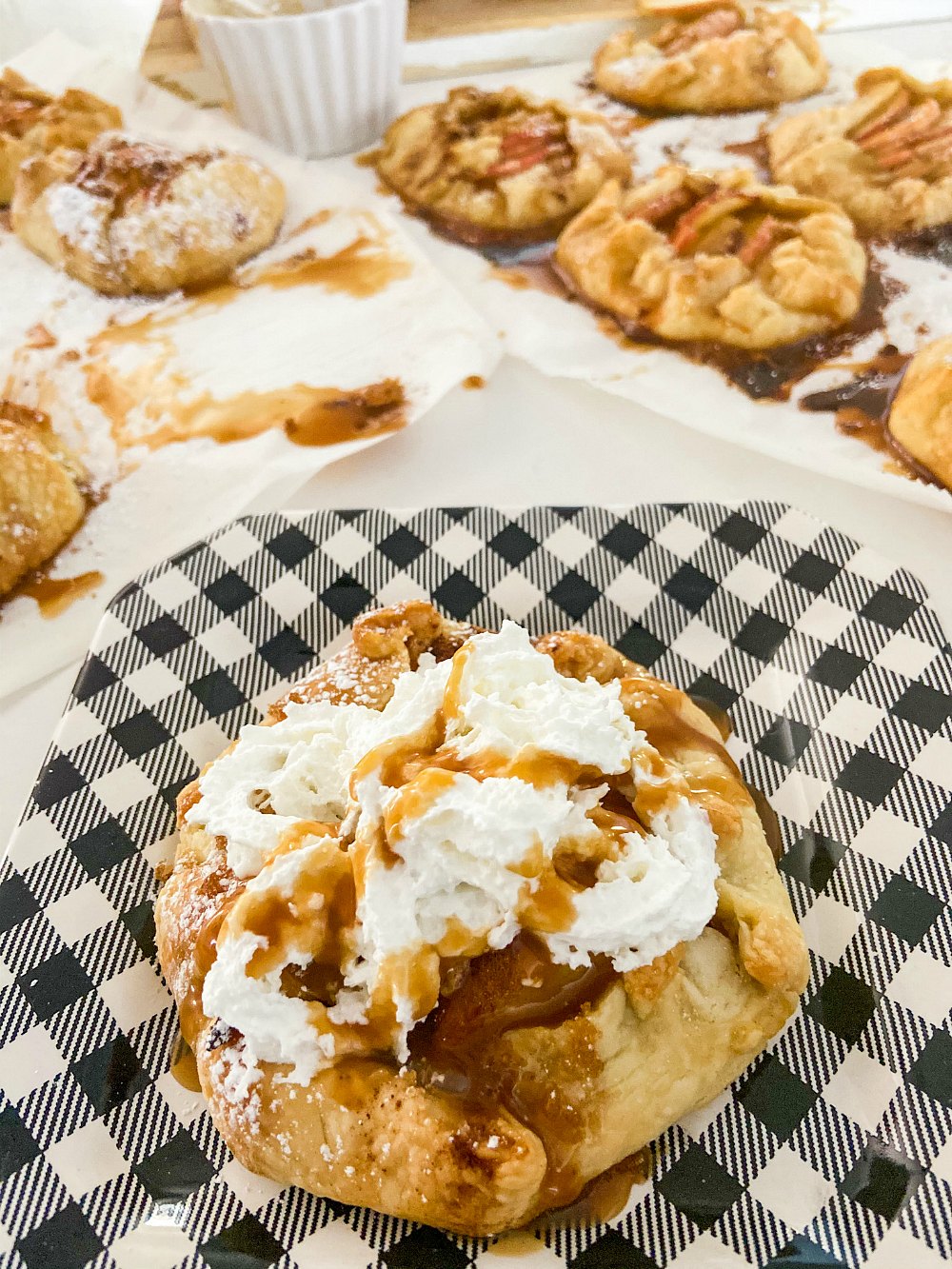 Rustic Mini Apple Galettes. It's apple season! Celebrate by making these easy rustic apple hand pies. They are perfect for fall picnics and family desserts! 
