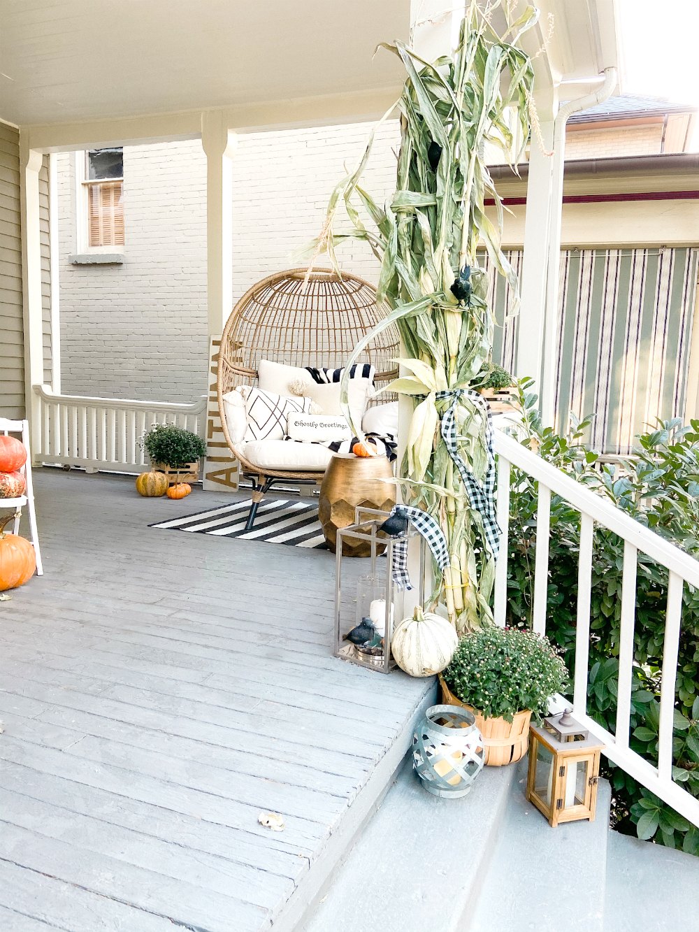 Boho Cottage Fall Porch Ideas. 5 Ways to Make an Outdoor Room for Fall. Use rattan furniture, potted flowers, pumpkins and cozy pillows to create a warm and welcoming fall porch. 