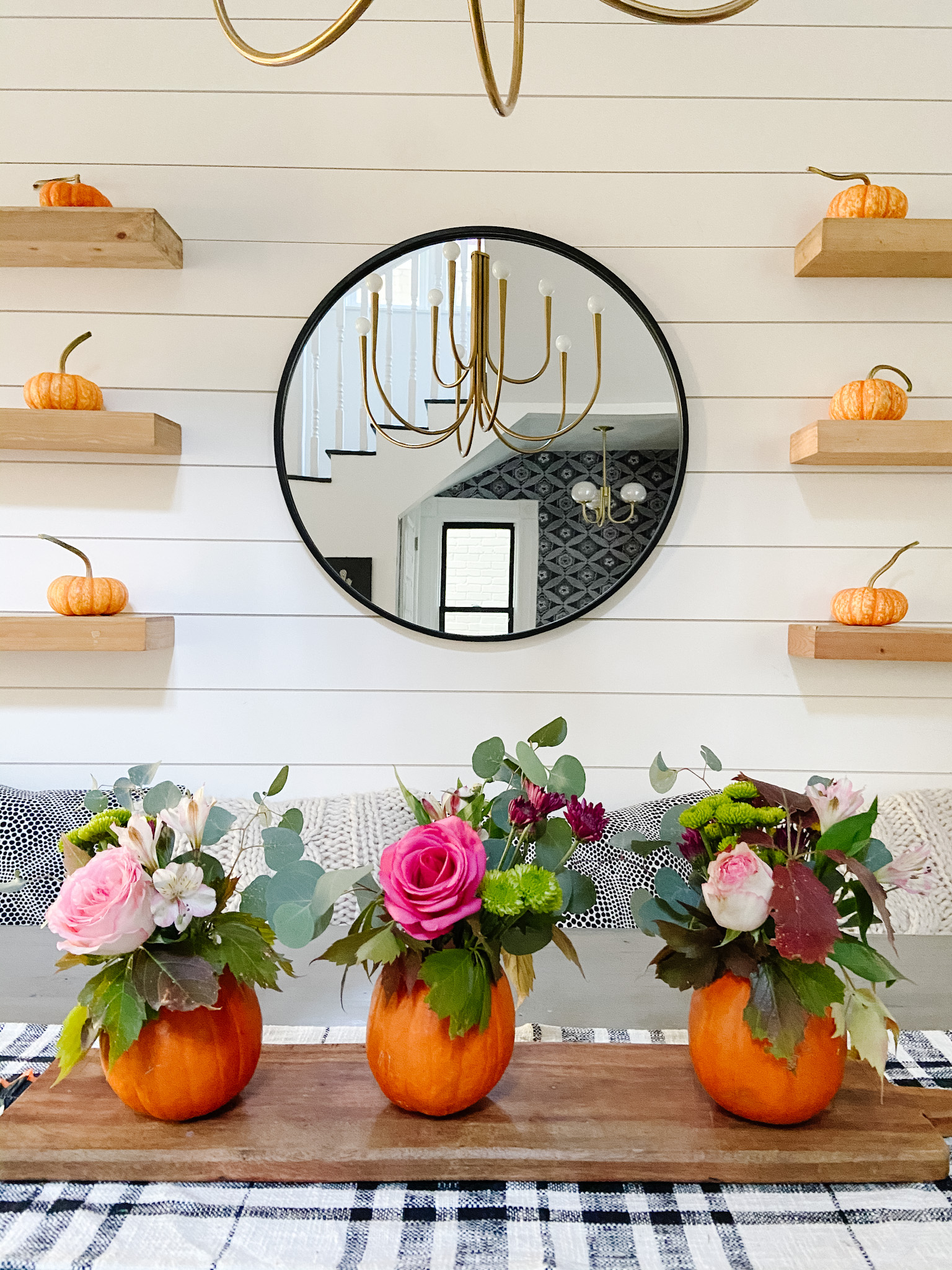 Mini Pumpkin Flower Arrangement Centerpieces. Care small pumpkins and display cut flowers for an festive fall centerpiece.