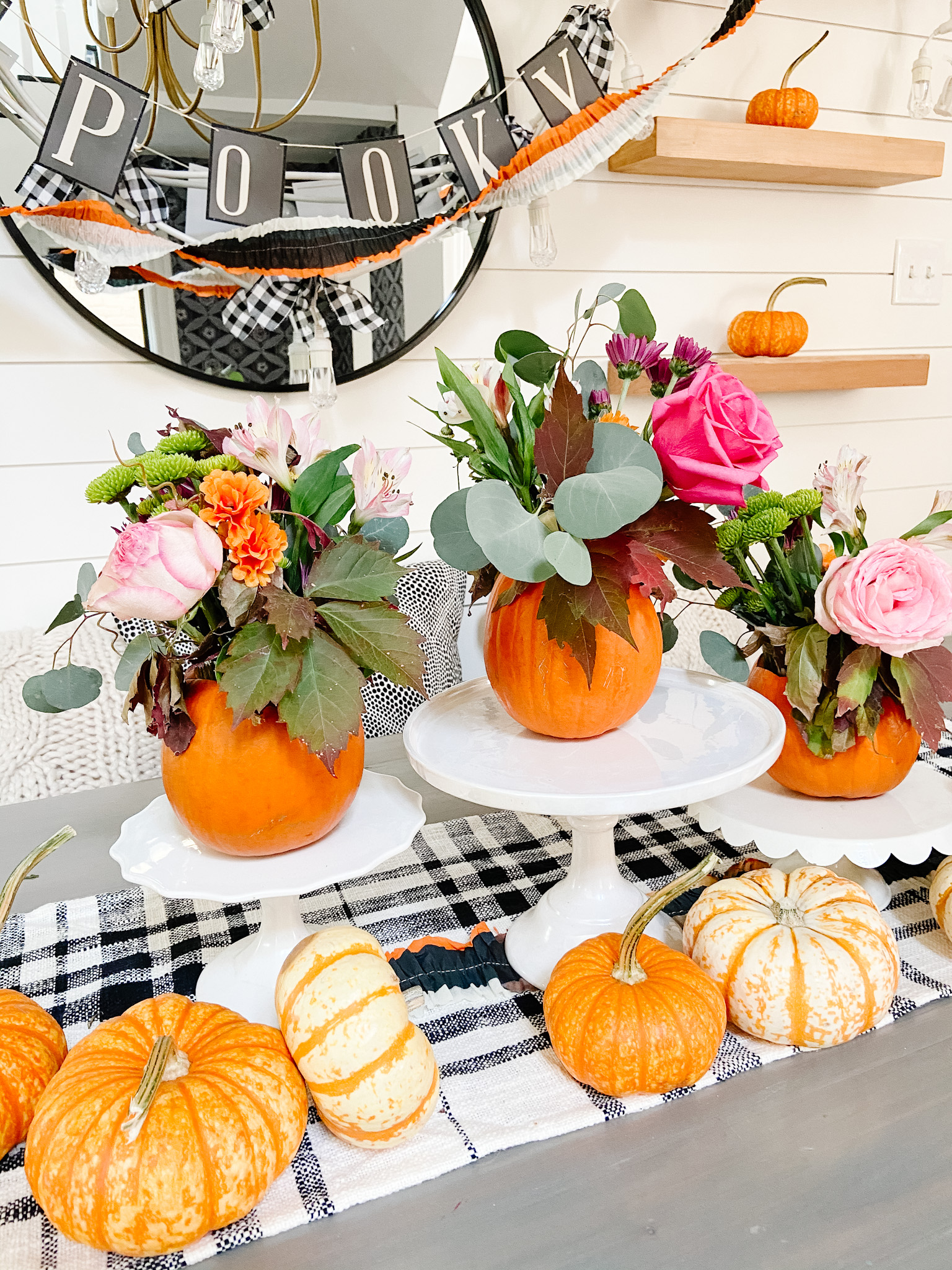 Mini Pumpkin Flower Arrangement Centerpieces. Care small pumpkins and display cut flowers for an festive fall centerpiece.