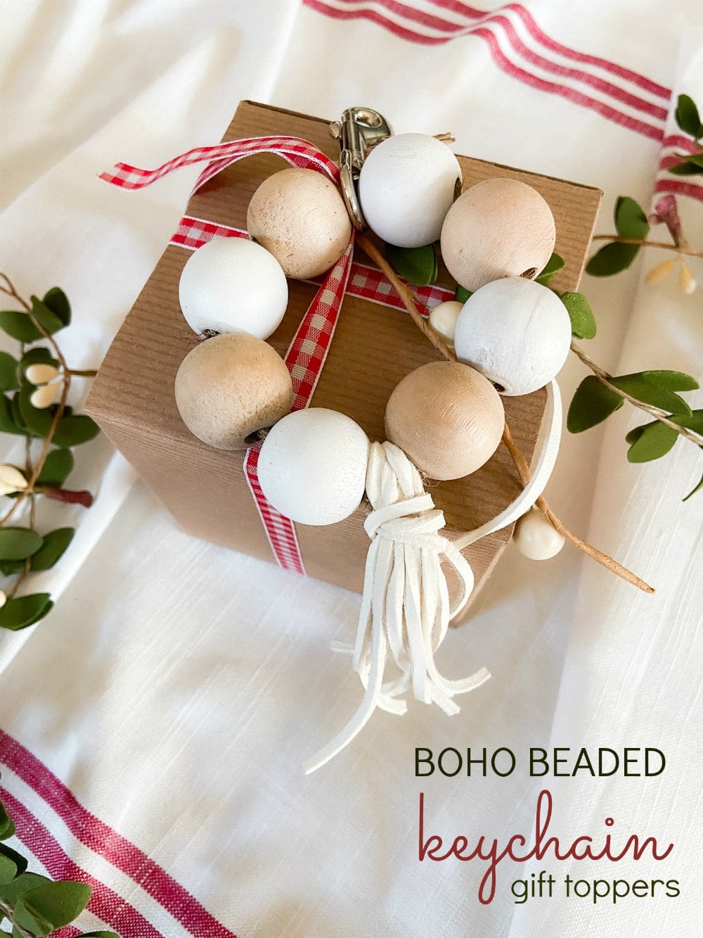 Boho Beaded Keychain Holiday Gift Toppers. Use beads, ribbon and twine to make the cutest handmade keychains that also make adorable gift toppers for the holidays.