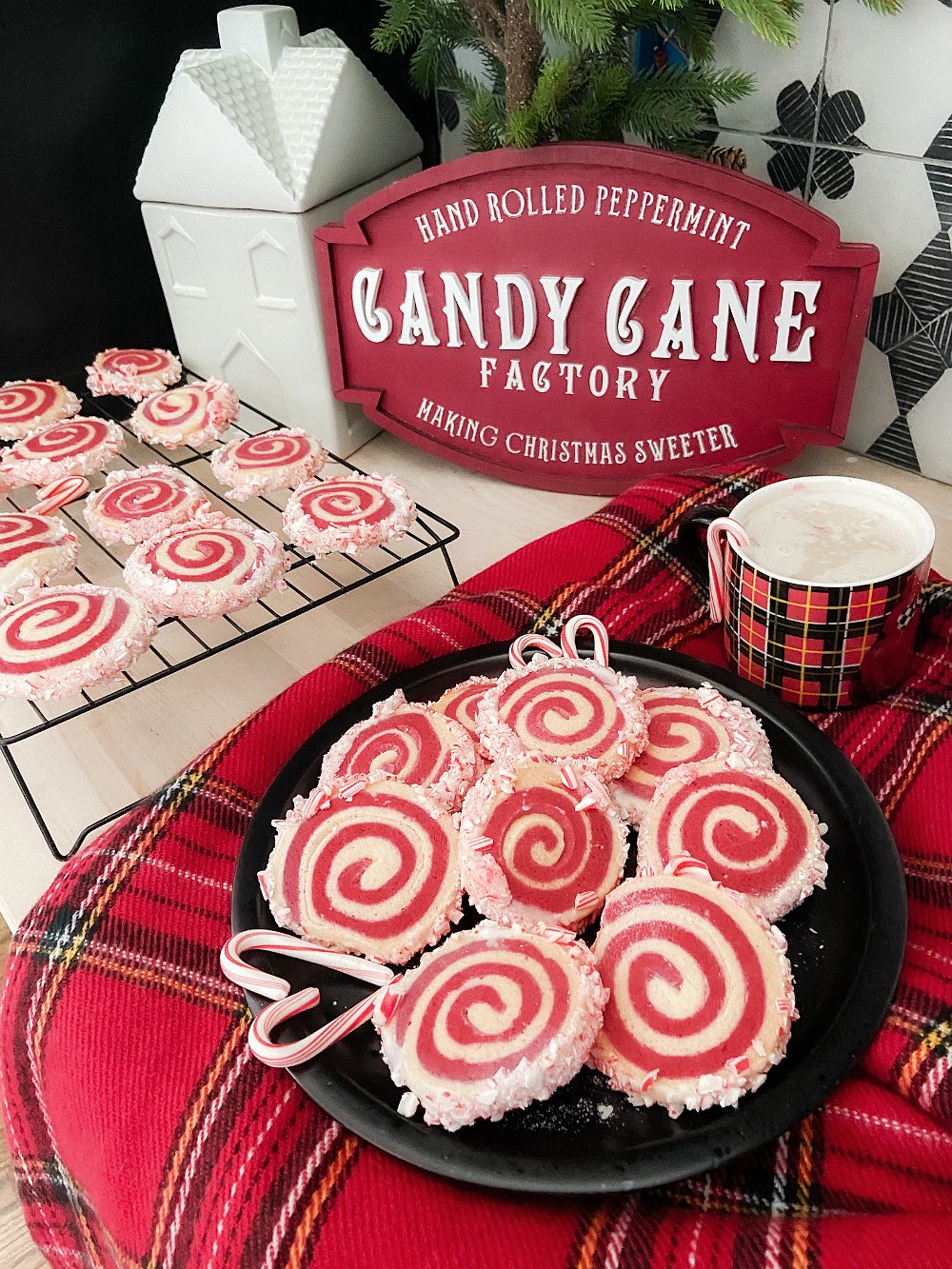 Candy Cane Frosted Swirl Cookies. Take the classic candy cane cookie and give it a modern update by rolling it and frosting it with crushed candy canes!