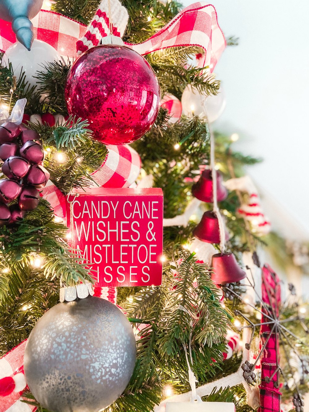 Candy Cane Themed Christmas Tree. Celebrate Christmas with a festive red and white tree filled with candy cane-themed projects, bells and felted garlands. 