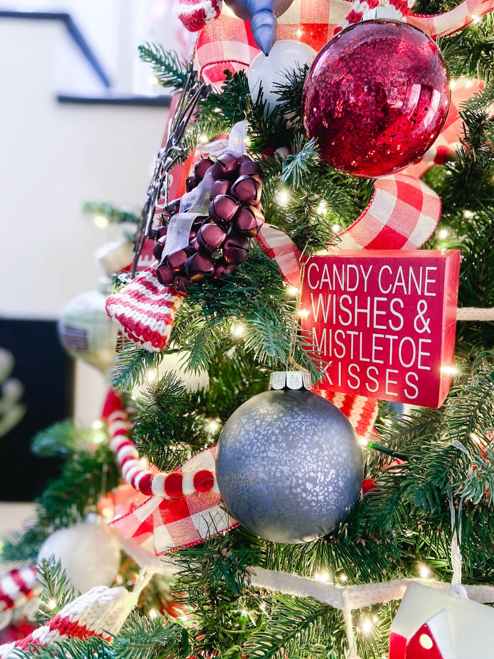 Candy Cane Themed Christmas Tree. Celebrate Christmas with a festive red and white tree filled with candy cane-themed projects, bells and felted garlands. 