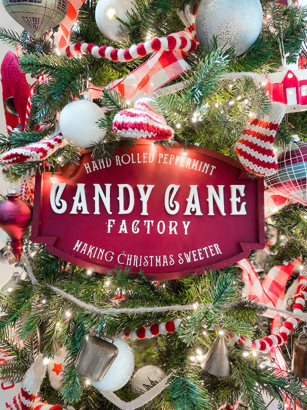 Candy Cane Themed Christmas Tree. Celebrate Christmas with a festive red and white tree filled with candy cane-themed projects, bells and felted garlands. 