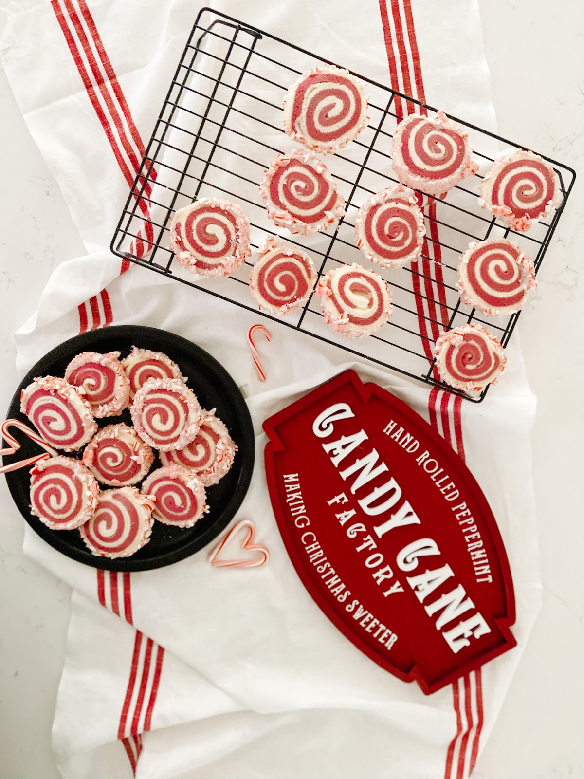 Candy Cane Frosted Swirl Cookies. Take the classic candy cane cookie and give it a modern update by rolling it and frosting it with crushed candy canes!